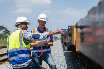 Engineers Discussing Project Progress at Construction Site, Engineer Team Inspecting Freight Train Cars and Cargo