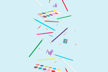 Back to school items on Blue Background.