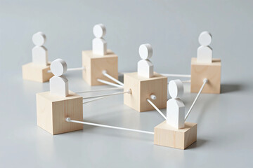 Obraz premium Wooden Cubes Connected with Lines on Blue Background Representing Social Network and Organizational Structure, Illustrating Teamwork, Digital Communication, and Business Collaboration