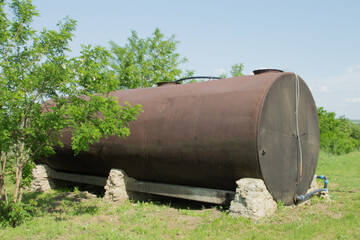A large metal object with a hole in the ground