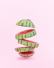 Watermelon fruit on a pink background. Summer concept with empty space.