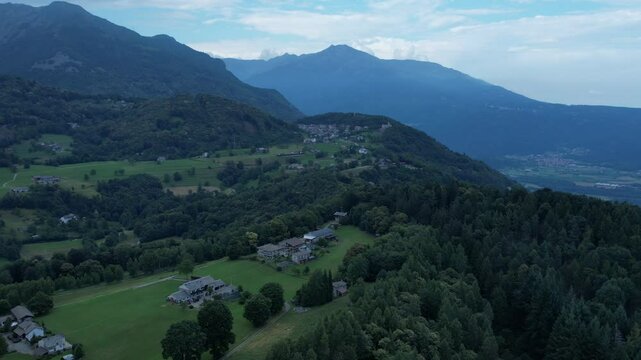 Aerial view of the Ivrea Morainic Amphitheatre, a vast glacial formation from the Pleistocene, with forests, farmland and villages near Ivrea, Italy, drone shot, slow motion