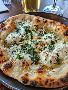 Indian naan bread with garlic butter and sauces on wooden table. AI Generative.