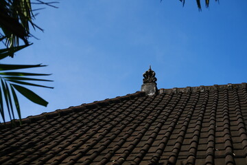 Traditional Balinese Roof Against Blue Sky