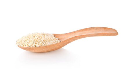 White sesame seeds in wood spoon isolated on white background.