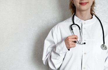 Healthcare professional taking notes in a clinical setting during a routine check-up