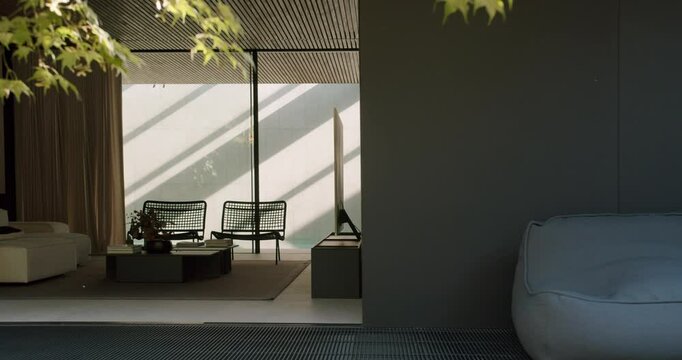 A stylish and contemporary home interior featuring a serene lounge area with modern chairs, floor-to-ceiling windows, and minimalist decor. Modern Home Interior with Elegant Furniture and Design