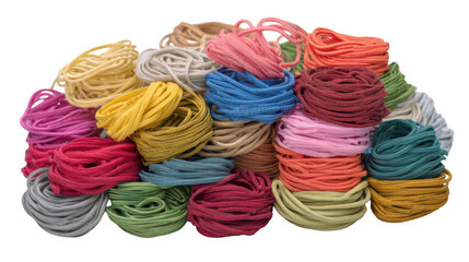 Many colorful elastic loops are piled up on a transparent background, creating a vibrant and textured display of crafting or sewing materials