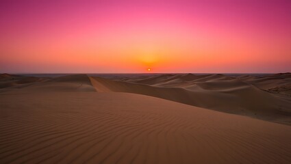Sunset over rolling sand dunes in the desert