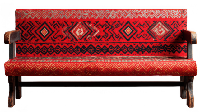 Studio shot of a refurbished wooden bench featuring vibrant geometric patterns in red and black on its upholstery, set against a transparent background