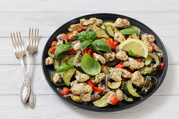 baked italian chicken and vegetables on a plate