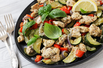 baked italian chicken and vegetables on a plate