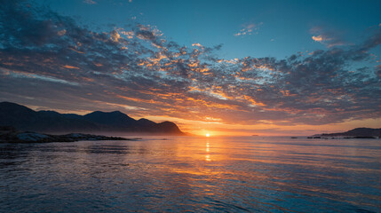 Beautiful Sunset Over the Ocean with Mountains in the Background
