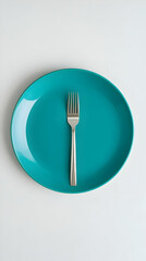 A Teal Oval Plate with a Silver Fork, Minimalist Table Setting, Simple and Clean Design,  Overhead View, Studio Shot.