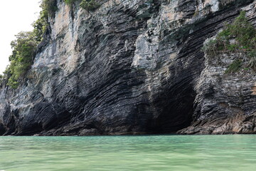  Pancake Rock is rock formation found in middle of Khanom Sea in Thailand. It is series of layered stone slabs (Sedimentary Process) covered with lush green forest and blue sea.  Geological wonders
