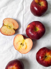 High-angle shot of apples on white cloth for summer concept