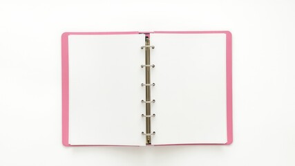 Open pink binder with blank white pages lying flat on a white surface waiting for notes and ideas