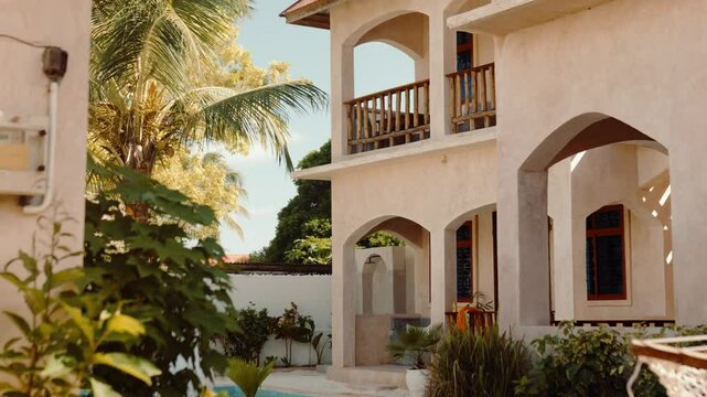 Hotel exterior with balcony and seating area, travel accommodation