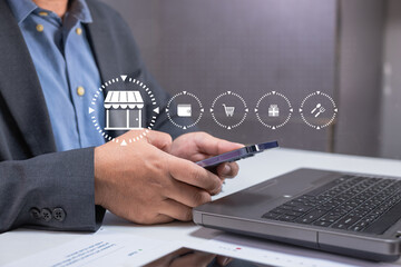 A businessperson uses a smartphone and laptop for online shopping, with digital commerce icons overlaid on the image.