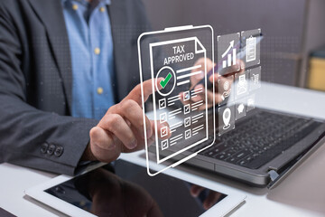 Fototapeta premium Businessman uses a digital tablet with a holographic 
