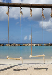 Two swings on the beach of Mambo Beach, Curaçao.