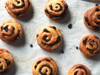 top view cinnamon raisin bread rolls on baking tray