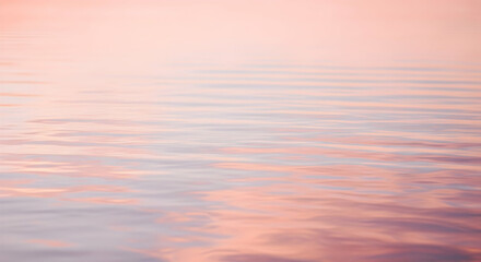 Tranquil abstract of soft pink water surface with gentle ripples and subtle reflections