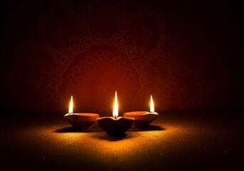 Traditional Diya Lamps with Flames – Diwali Festival Candle Light Decor.