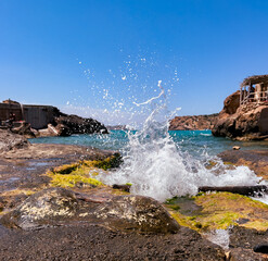 waves crashing on rocks