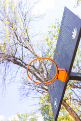 A basketball hoop with a ball in the air