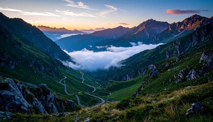 Obraz premium Scenic Mountain Landscape at Sunrise With a Path Leading Through the Valley