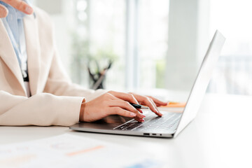 Close-up portrait typing keyboard on laptop computer. Working online on white table at office. Facebook chat. Website meeting. Blogger. Journalist writing articles. online job ideas