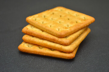 Cream crackers on a black background