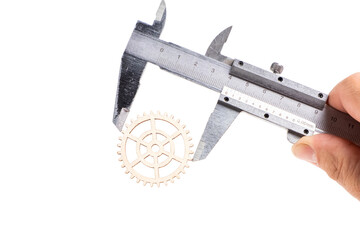 Vernier caliper with gear wheel on white background. Industrial concept. Isolated