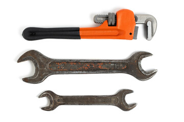 Set of old adjustable wrenches highlighted on white background.