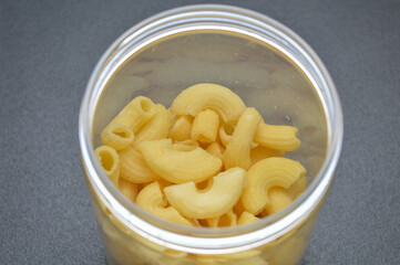 close up of macaroni or maccheroni food on black background