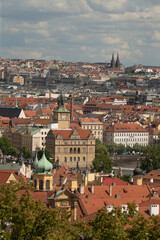 Obraz premium Experience the breathtaking panoramic view of Prague, showcasing its iconic rooftops, stunning architecture, and enchanting landscape that charms visitors and locals alike