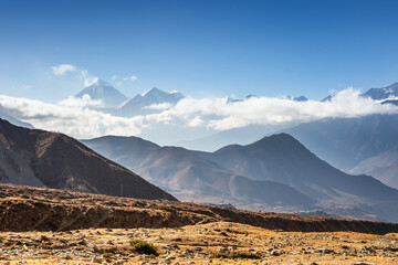 Kali Gandaki valley near Jhong village. Mt. Dhaulagiri and Tukuche over the autumn meadow and...