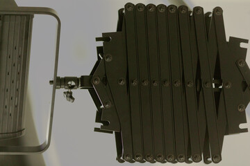 This professional film light features barn doors, an adjustable handle, and a focus mechanism for...