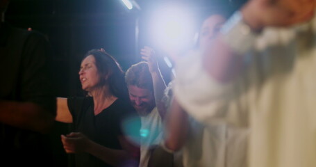 Congregants applauding in spiritual unity, mixed group of people celebrating faith during evangelical church service, hands clapping, expressions of worship and devotion