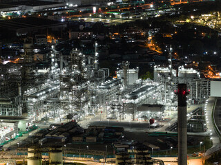 Factory-oil and gas industry, Oil refinery industrial plant at night, oil and gas chemical tank with oil refinery plant background at twilight, business power and energy chemical barrel