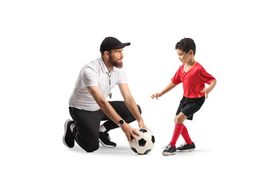 Coach and boy at football training
