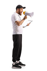 Full length profile shot of a sports coach shouting with a megaphone