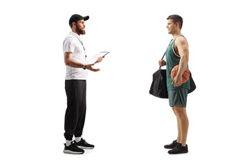Full length profile shot of a sports coach talking to a basketball player