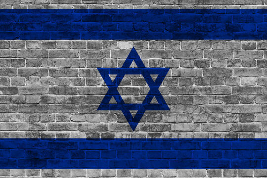 Flag of Israel painted onto a grunge brick wall. Independence Day of Israel 22th of April.