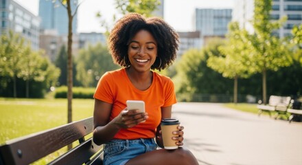 Young woman enjoying a sunny day in the park with coffee and smartphone
