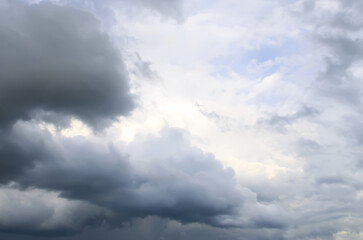 A blue sky with soft, dramatic clouds.