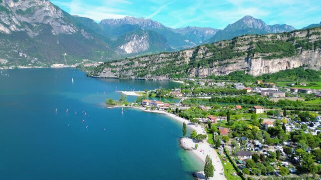 Drone view of northern Lake Garda near Torbole, Linfano. Surrounded by mountains, clear turquoise water, beaches, campings, and Monte Brione&mdash;perfect for nature, sport, and summer vacations