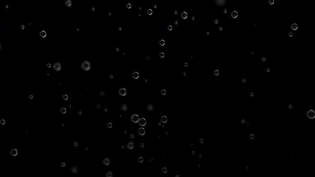 Floating transparent bubbles rising on black background, perfect for use as overlay in underwater scenes, cosmetics, luxury effects, abstract motion design, or cinematic elements.

