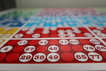printing of colored and numbered game cards called bingo in the printing house. selective focus